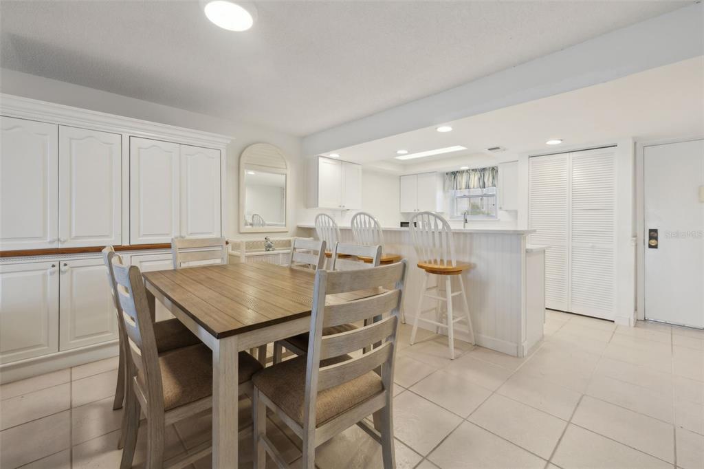 125 River Bend Road, Unit D Welaka, FL 32193 - Photo 19 of 53 a kitchen with kitchen island a table and chairs in it