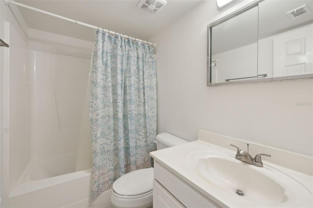125 River Bend Road, Unit D Welaka, FL 32193 - Photo 24 of 53 a bathroom with a sink a toilet and shower
