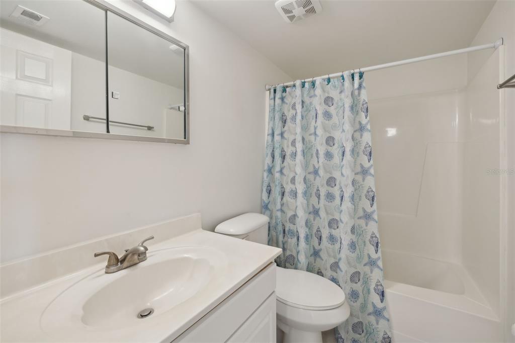125 River Bend Road, Unit D Welaka, FL 32193 - Photo 27 of 53 a bathroom with a sink toilet and shower