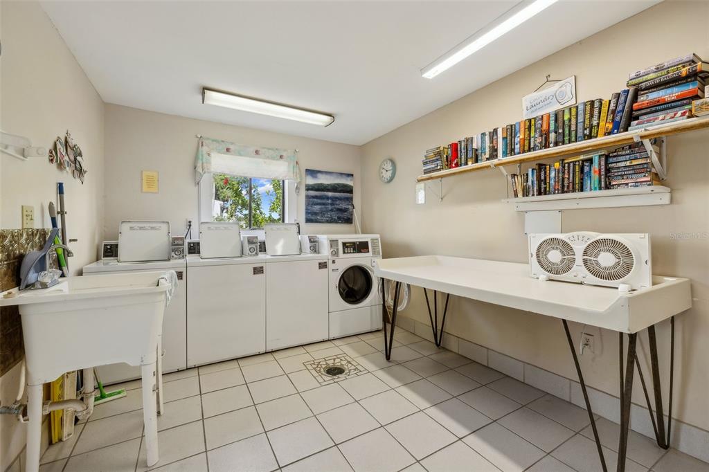 125 River Bend Road, Unit D Welaka, FL 32193 - Photo 34 of 53 a room with furniture a air conditioner and a window