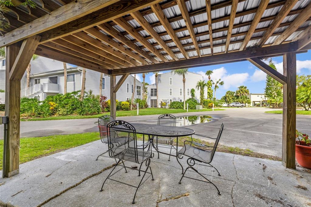 125 River Bend Road, Unit D Welaka, FL 32193 - Photo 36 of 53 a view of a porch with furniture and garden