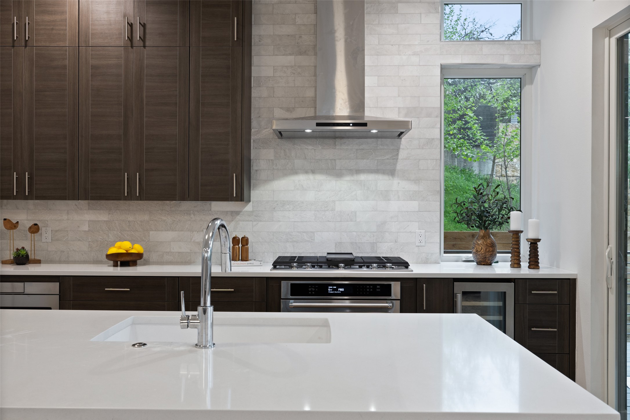 900 South 2nd Street, Unit 20 Austin, TX 78704 - Photo 17 of 40 a kitchen with a sink a stove and a window