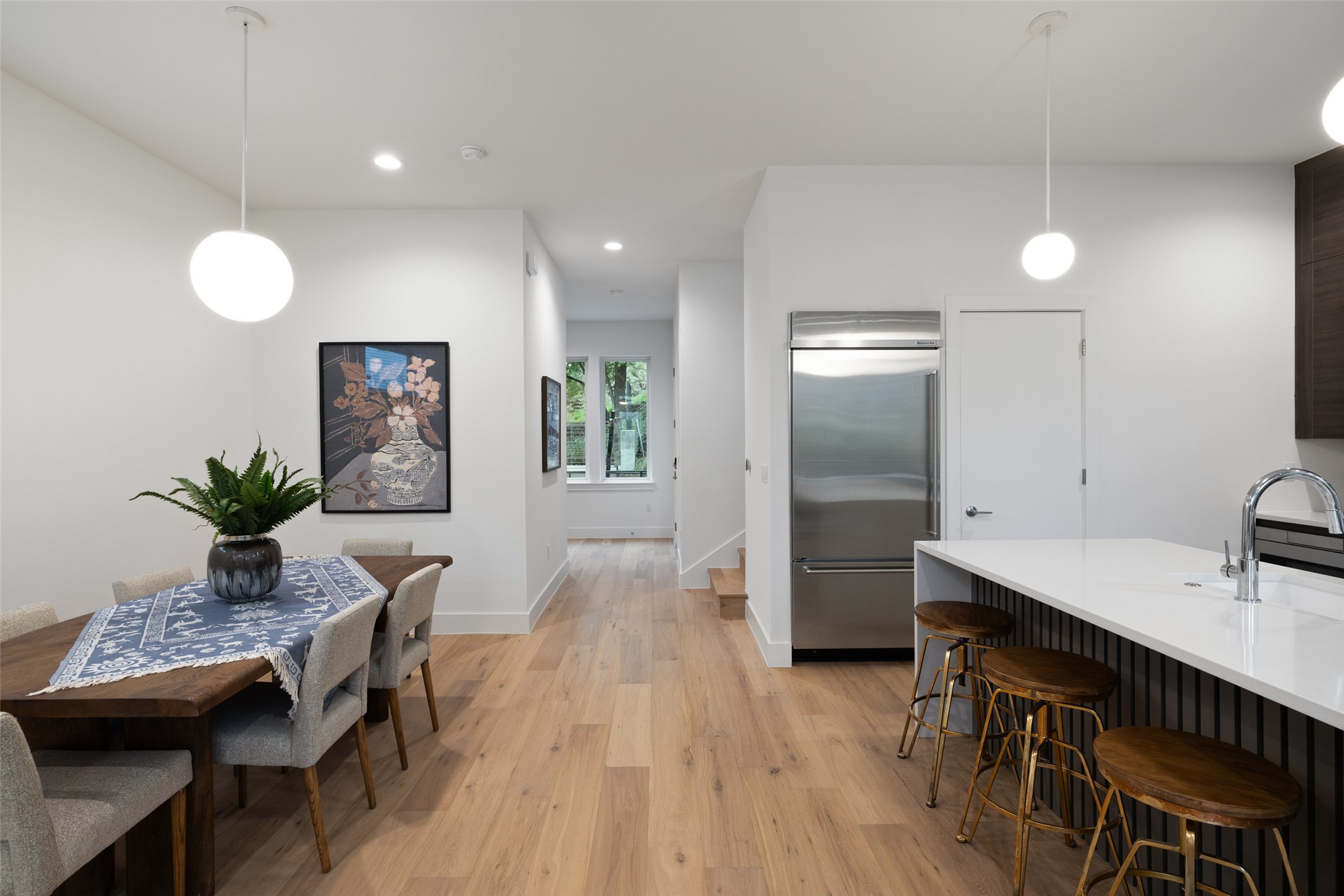 900 South 2nd Street, Unit 20 Austin, TX 78704 - Photo 26 of 40 a kitchen with sink refrigerator and dining table