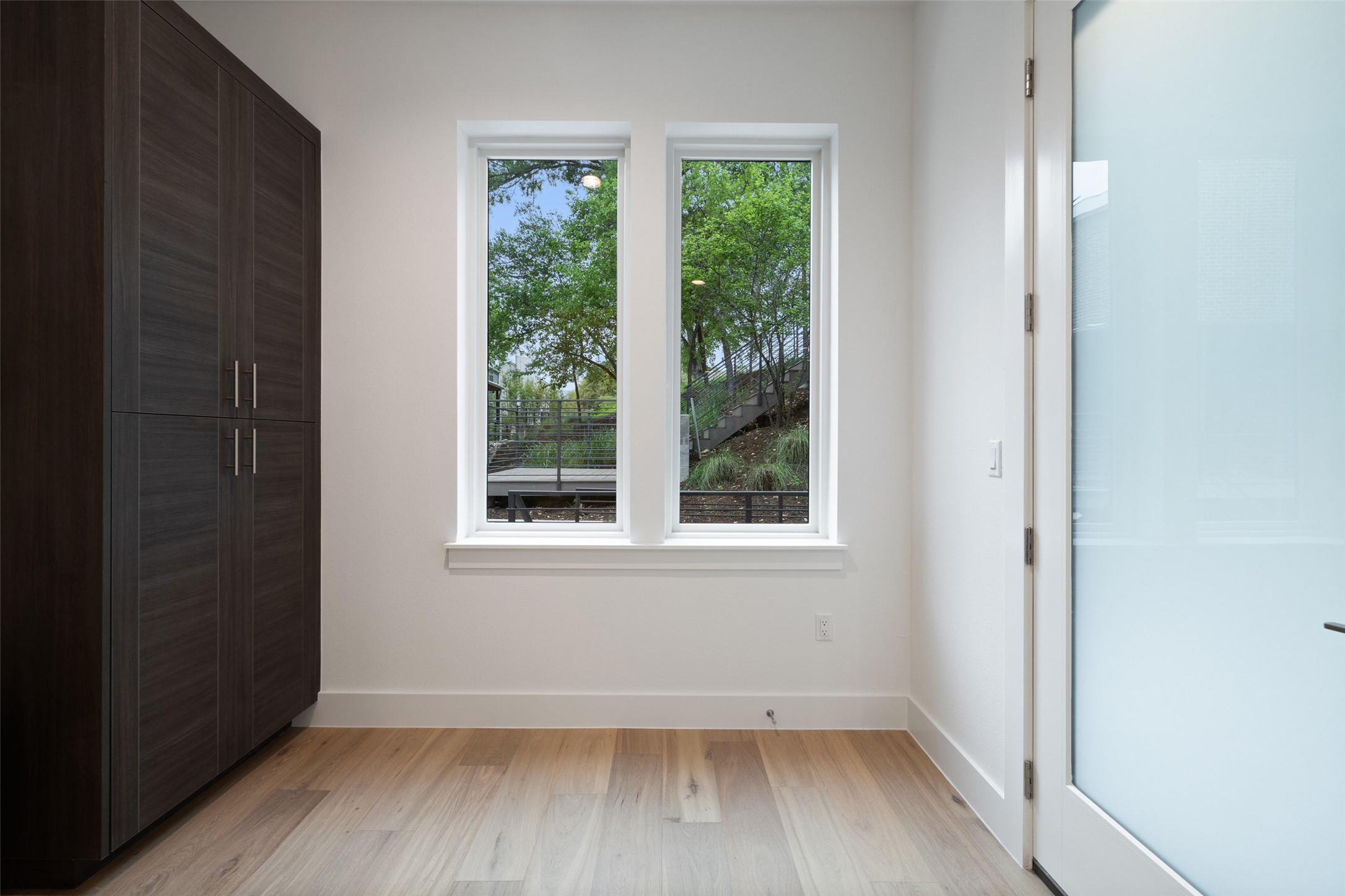 900 South 2nd Street, Unit 20 Austin, TX 78704 - Photo 29 of 40 an empty room with wooden floor and windows