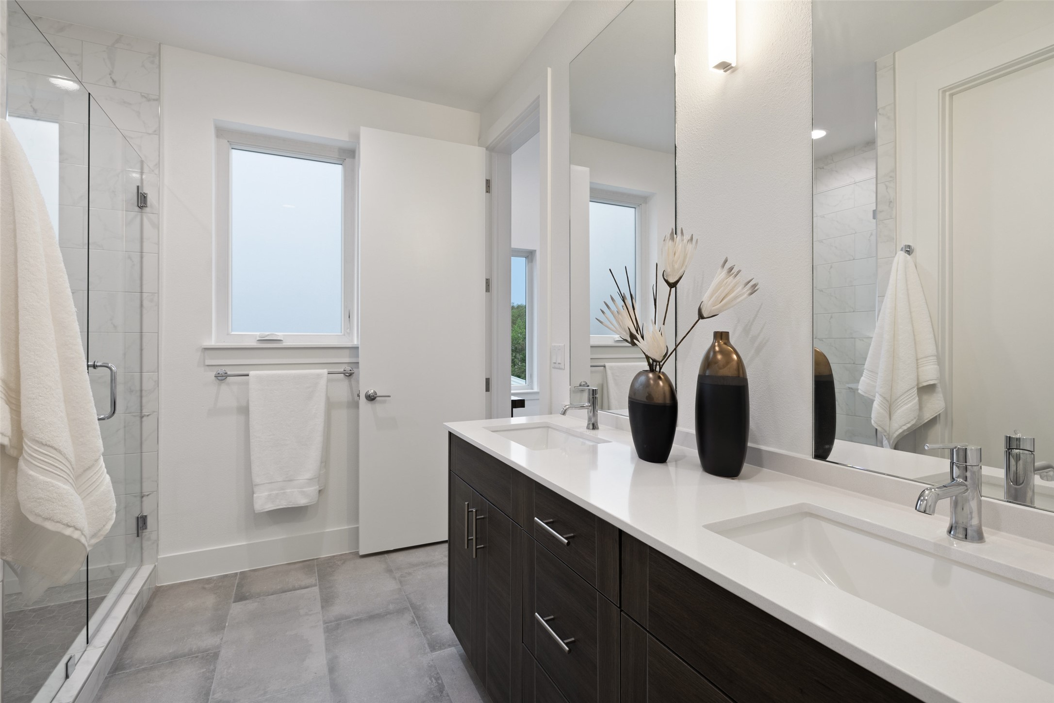 900 South 2nd Street, Unit 20 Austin, TX 78704 - Photo 39 of 40 a bathroom with a double vanity sink a vanity and a mirror