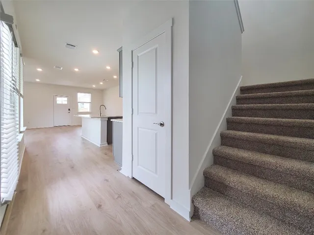 a view of an entryway with wooden floor