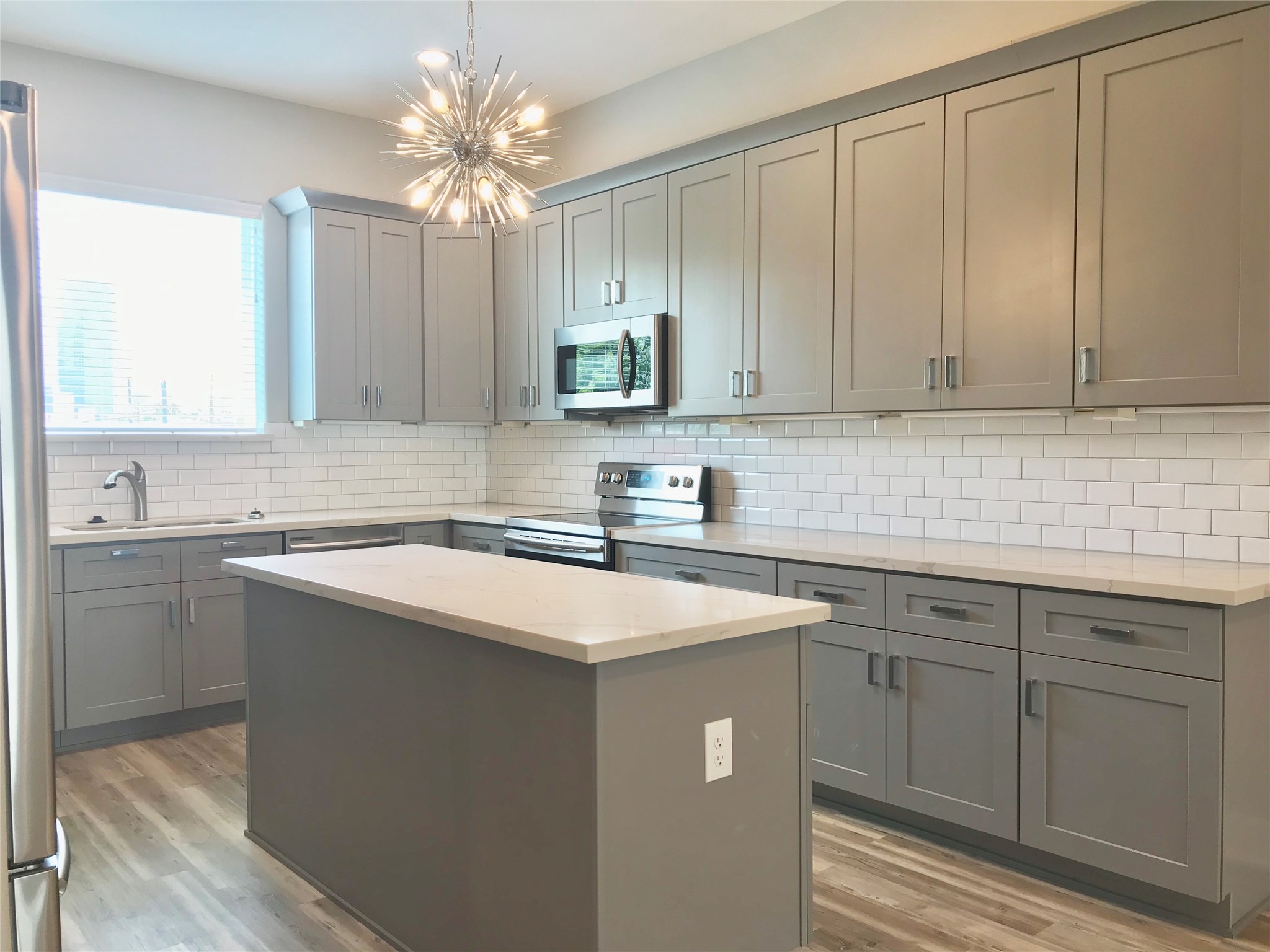 1111 Edwards Street Houston, TX 77007 - Photo 13 of 50 Loving this kitchen!! Notice the island space and cool lighting!