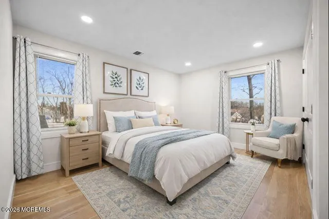 a bedroom with a bed and a couch