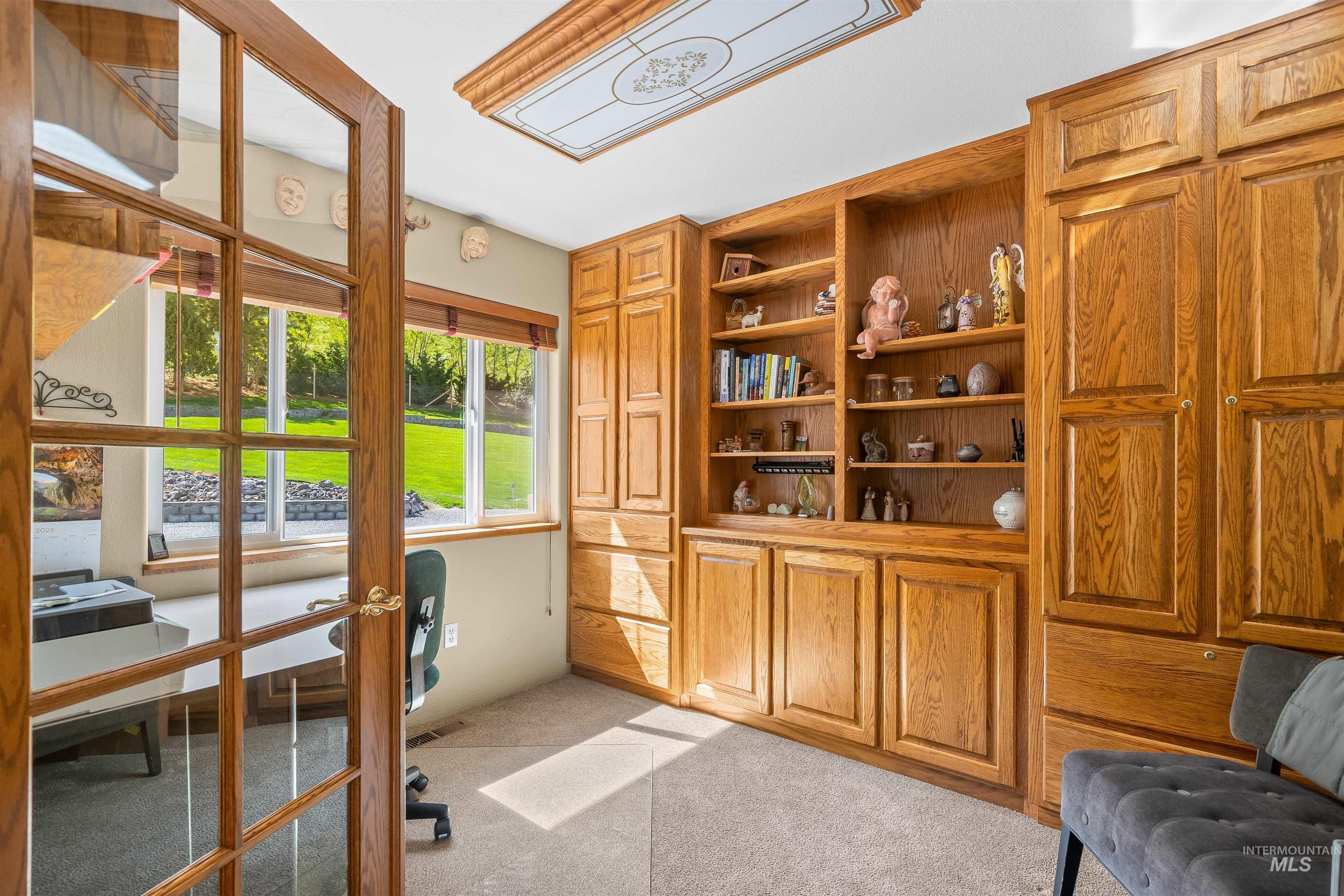 11056 Snake River Road Asotin, WA 99402 - Photo 12 of 50 Office area with light carpet and built in shelves