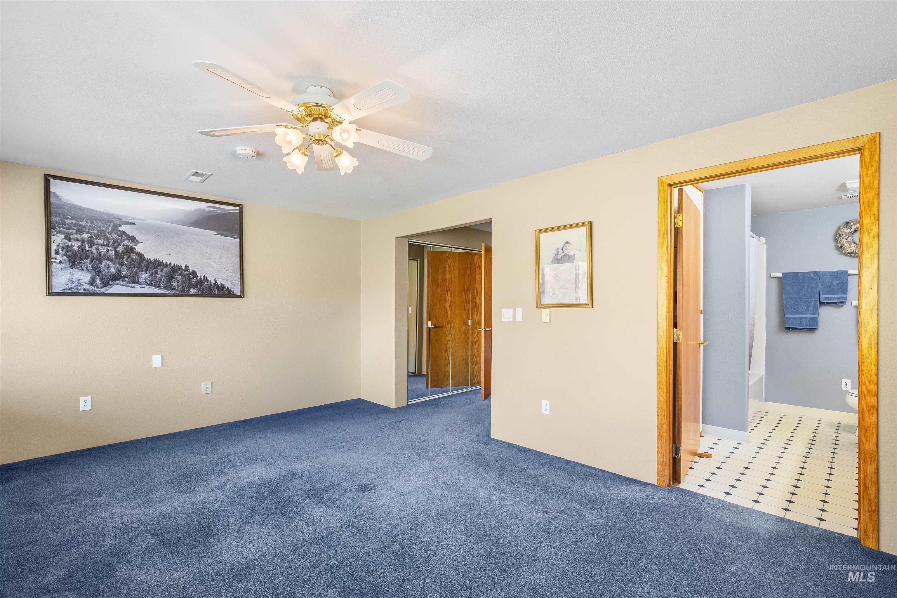 11056 Snake River Road Asotin, WA 99402 - Photo 30 of 50 Carpeted spare room with ceiling fan