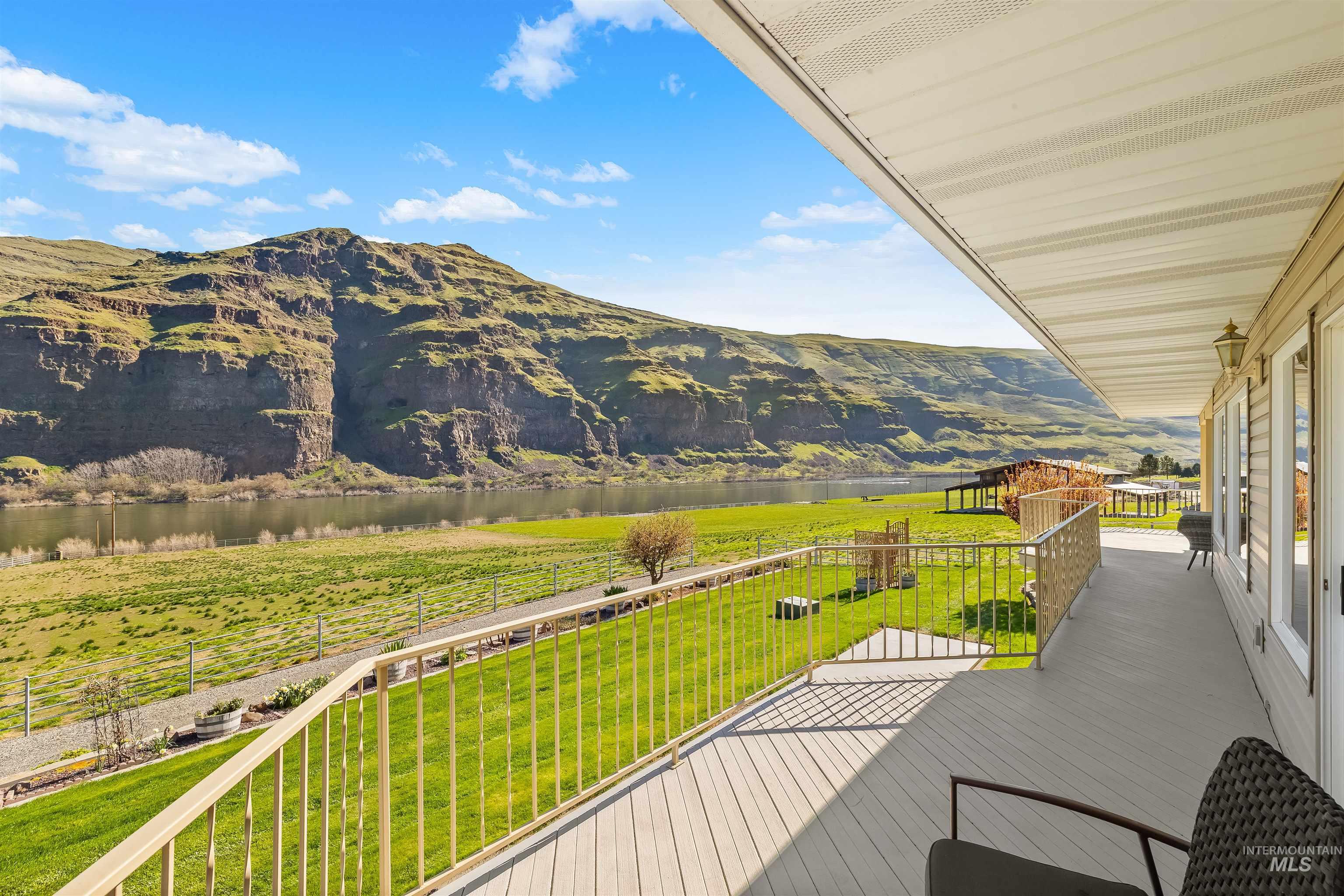 11056 Snake River Road Asotin, WA 99402 - Photo 36 of 50 Deck featuring a yard and a mountain view