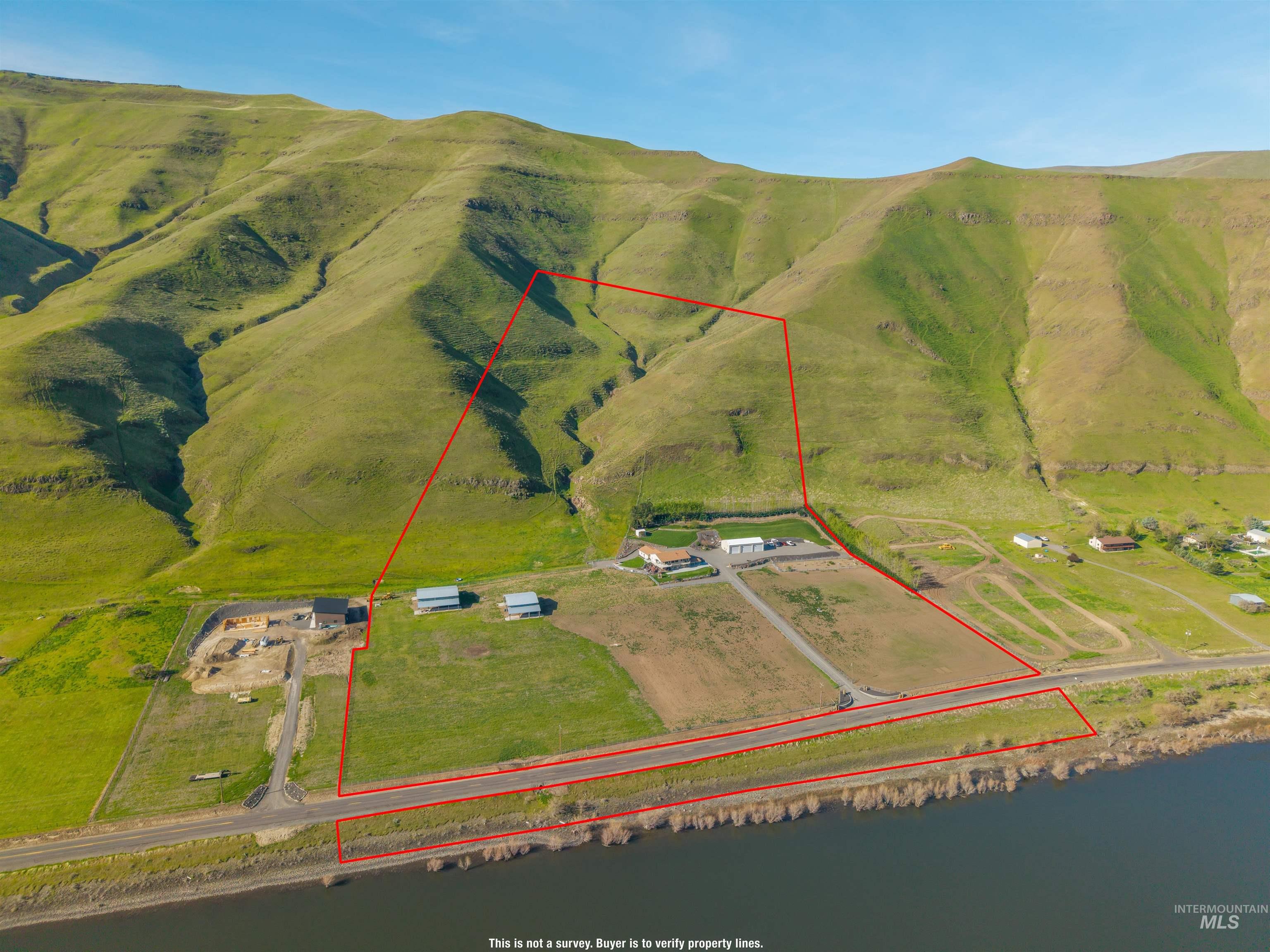 11056 Snake River Road Asotin, WA 99402 - Photo 5 of 50 Overview of rural landscape featuring property boundaries highlighted and a mountainous background