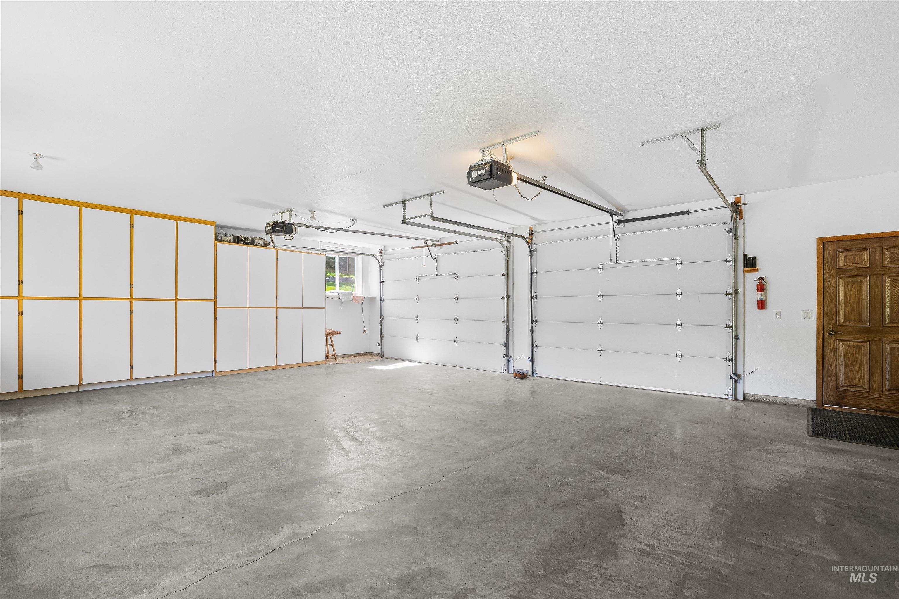 11056 Snake River Road Asotin, WA 99402 - Photo 8 of 50 Garage with a garage door opener