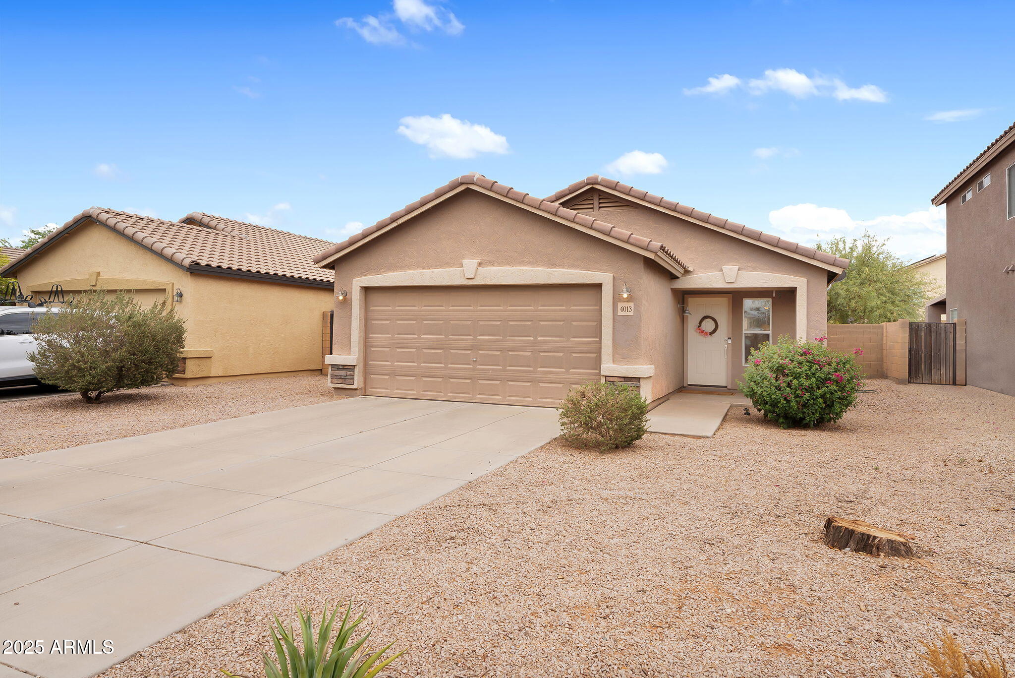 4013 East Superior Road San Tan Valley, AZ 85143 - Photo 1 of 31 a view of a house with a yard and large tree