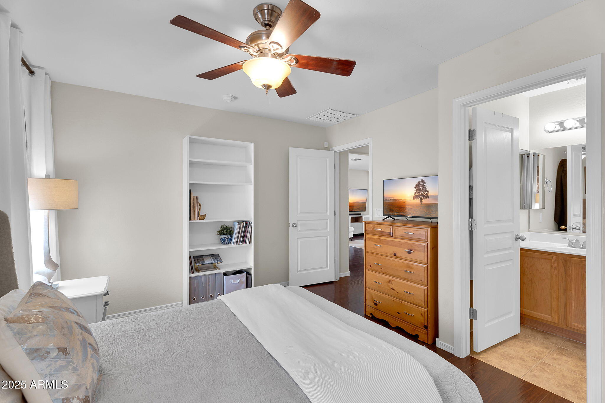 4013 East Superior Road San Tan Valley, AZ 85143 - Photo 12 of 31 a bedroom with a bed and a chandelier