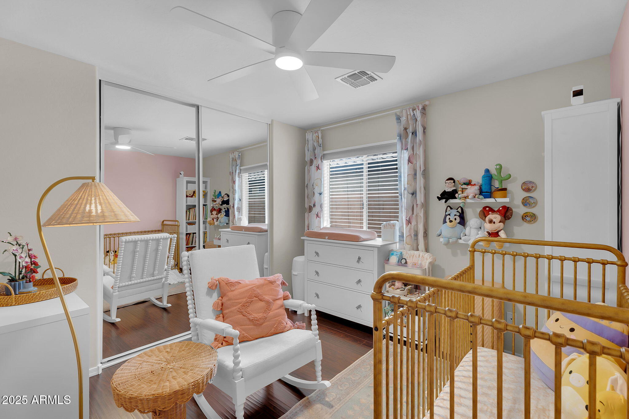 4013 East Superior Road San Tan Valley, AZ 85143 - Photo 16 of 31 a bedroom with furniture a baby crib and a wooden floor