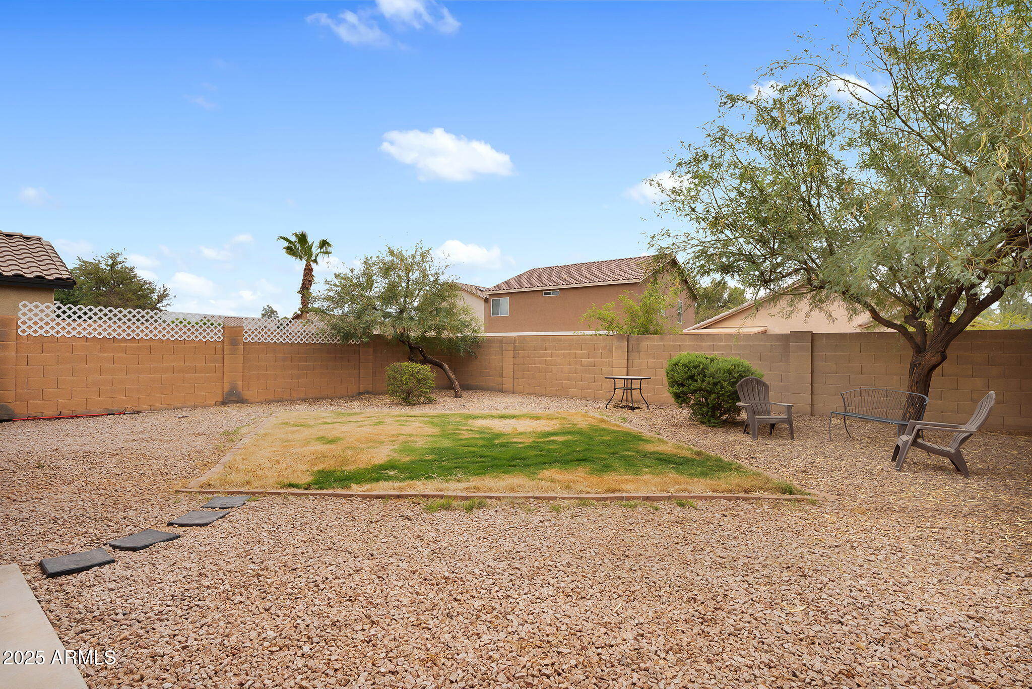 4013 East Superior Road San Tan Valley, AZ 85143 - Photo 21 of 31 a house with a yard and a large tree