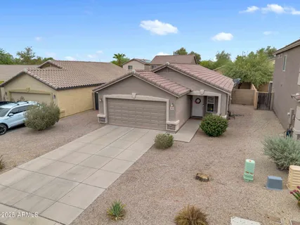 a house with a yard and a large tree