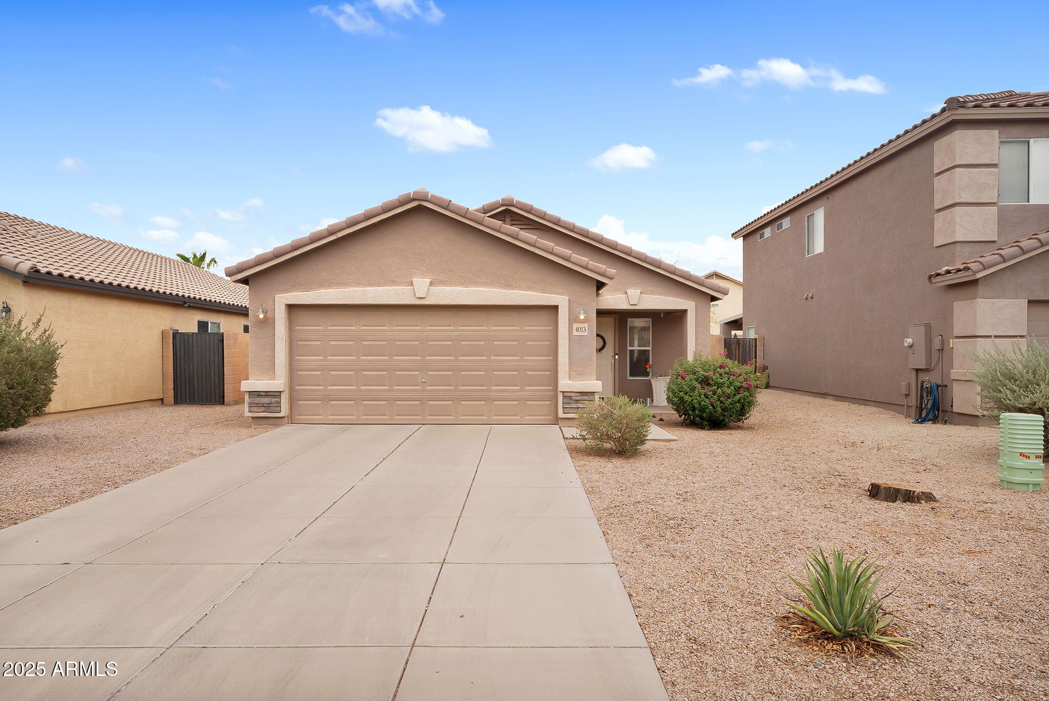 4013 East Superior Road San Tan Valley, AZ 85143 - Photo 30 of 31 a front view of a house with a yard and garage