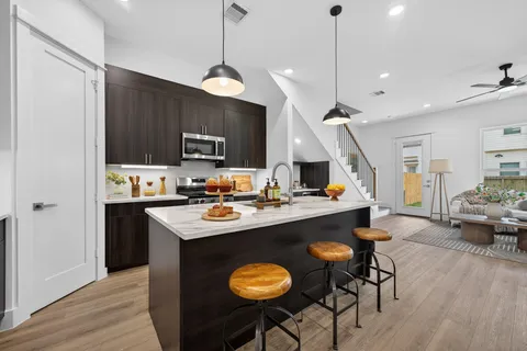 a kitchen with a sink and a refrigerator