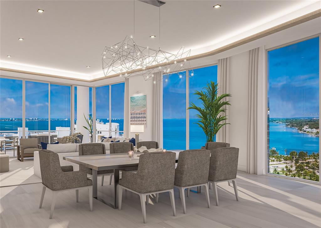 555 Quay Commons, Unit 1605 Sarasota, FL 34236 - Photo 2 of 14 a view of a dining room with furniture window and wooden floor