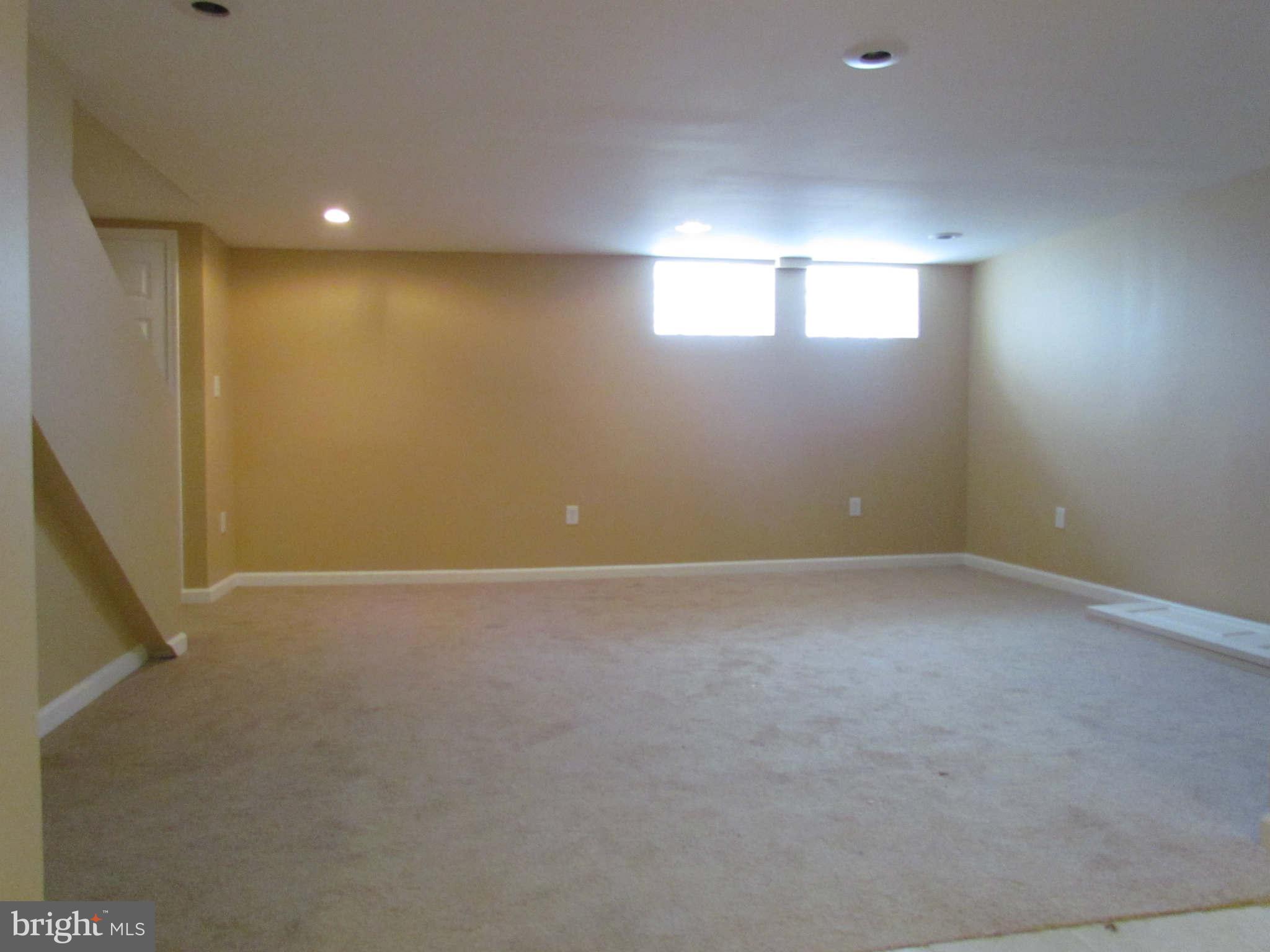 1604 Northbourne Road Baltimore, MD 21239 - Photo 7 of 12 a view of an empty room with a window