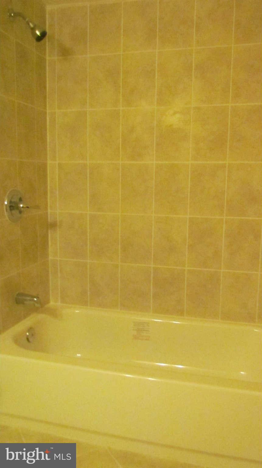 1604 Northbourne Road Baltimore, MD 21239 - Photo 9 of 12 a bathroom with a shower