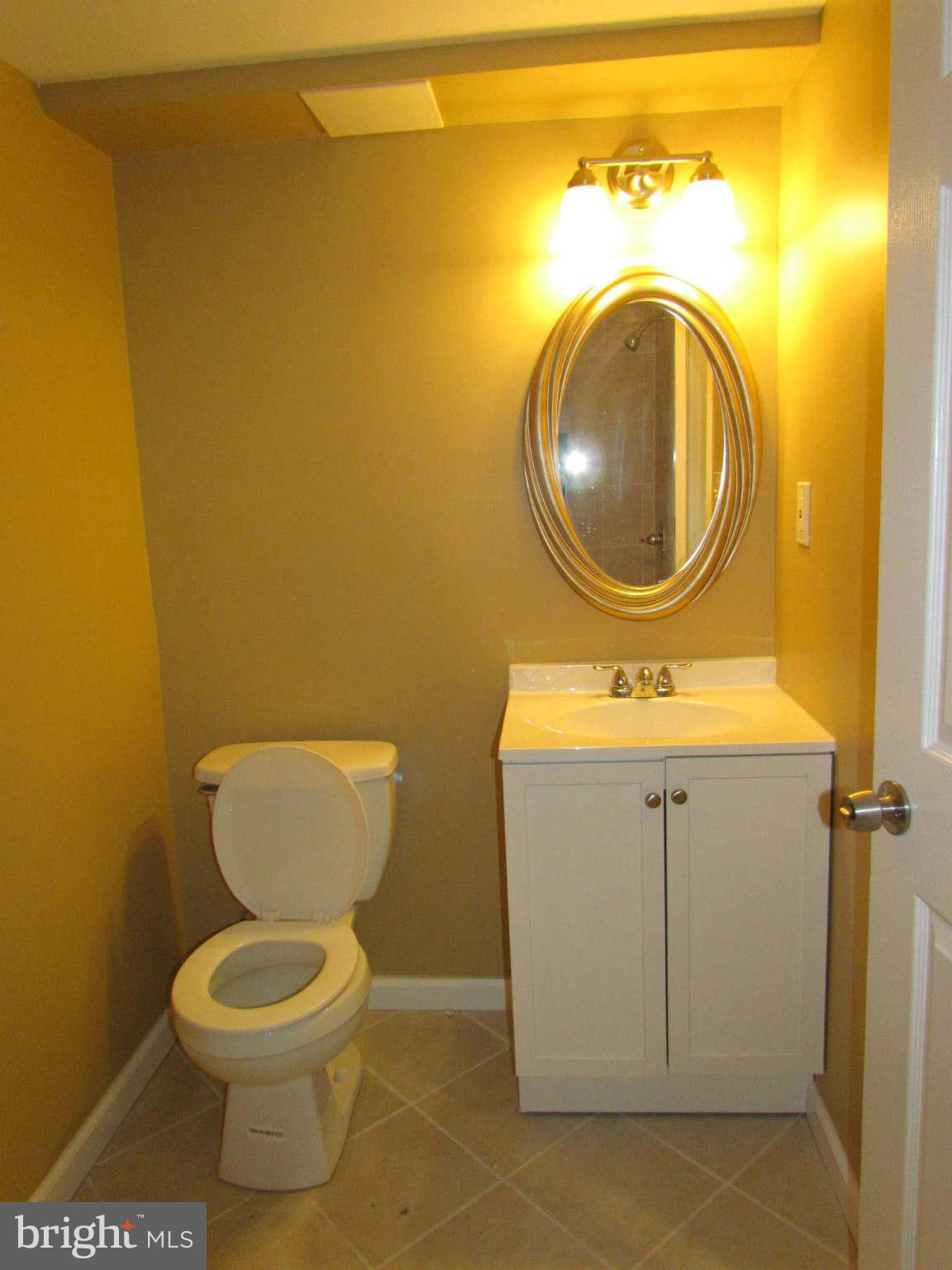 1604 Northbourne Road Baltimore, MD 21239 - Photo 10 of 12 a bathroom with a toilet and a sink