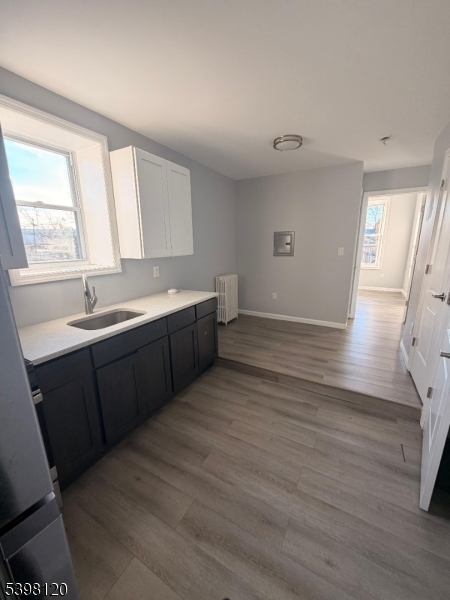 17 Teaneck Road, Unit 3C Ridgefield Park, NJ 07660 - Photo 4 of 9 a room with wooden floors and sink