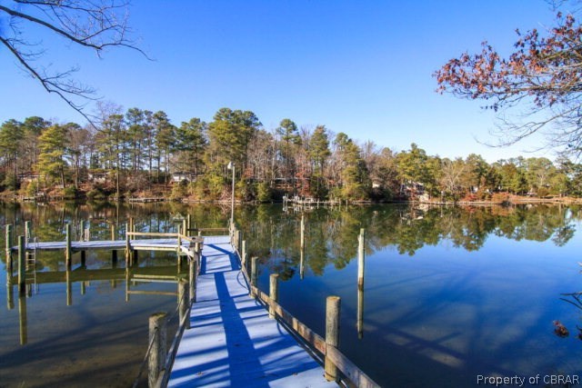 271 Burnt Wharf Road Lancaster, VA 22503 - Photo 25 of 35 a view of a lake with a mountain in the background