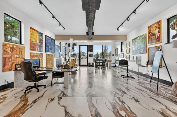 a view of a livingroom with dining room and kitchen view