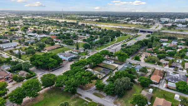 an aerial view of a city with a lake view