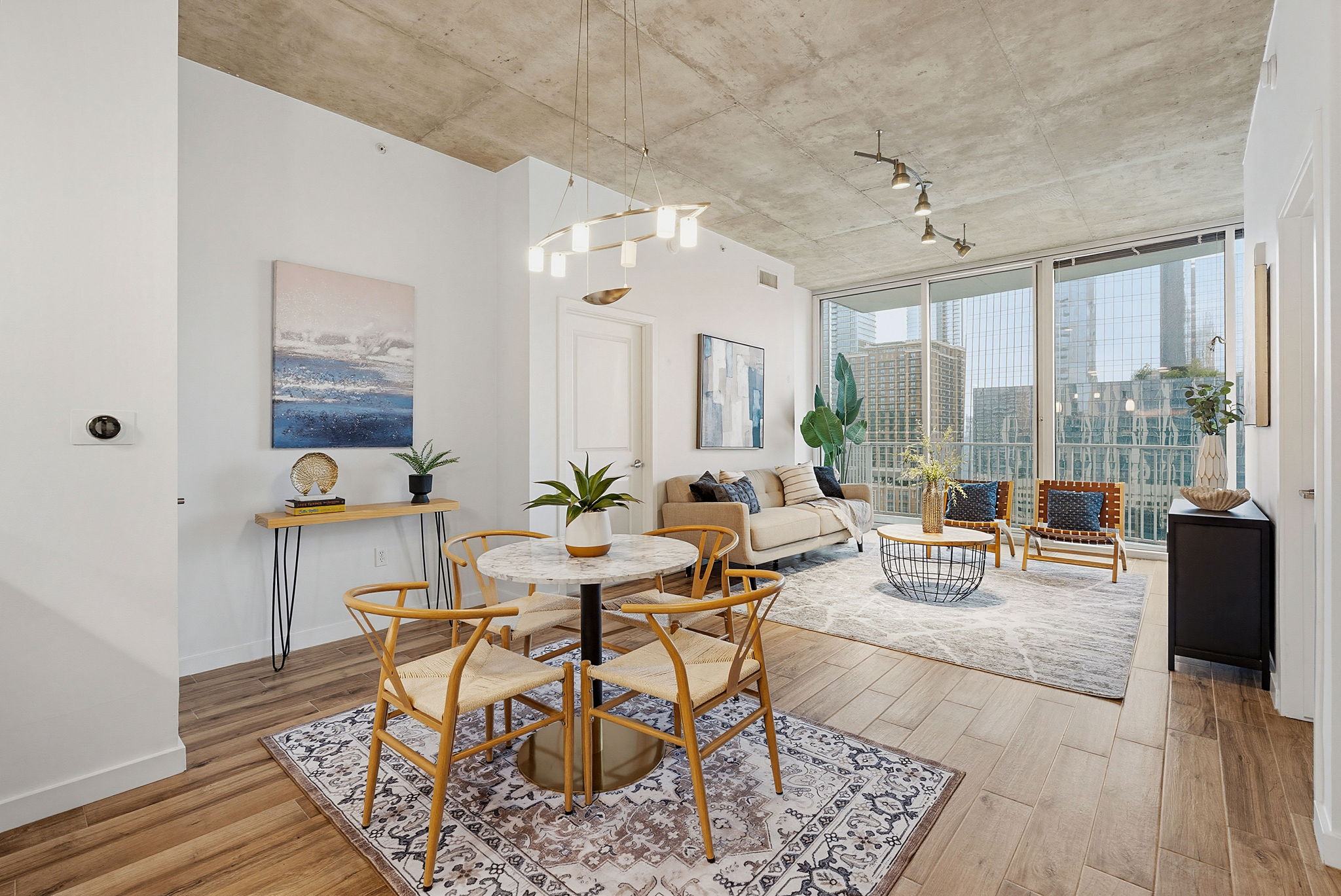 360 Nueces Street, Unit 1505 Austin, TX 78701 - Photo 1 of 28 a living room with furniture and wooden floor