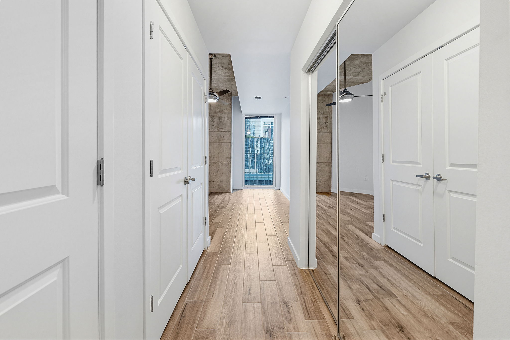 360 Nueces Street, Unit 1505 Austin, TX 78701 - Photo 15 of 28 a view of a room with wooden floor and a bathroom