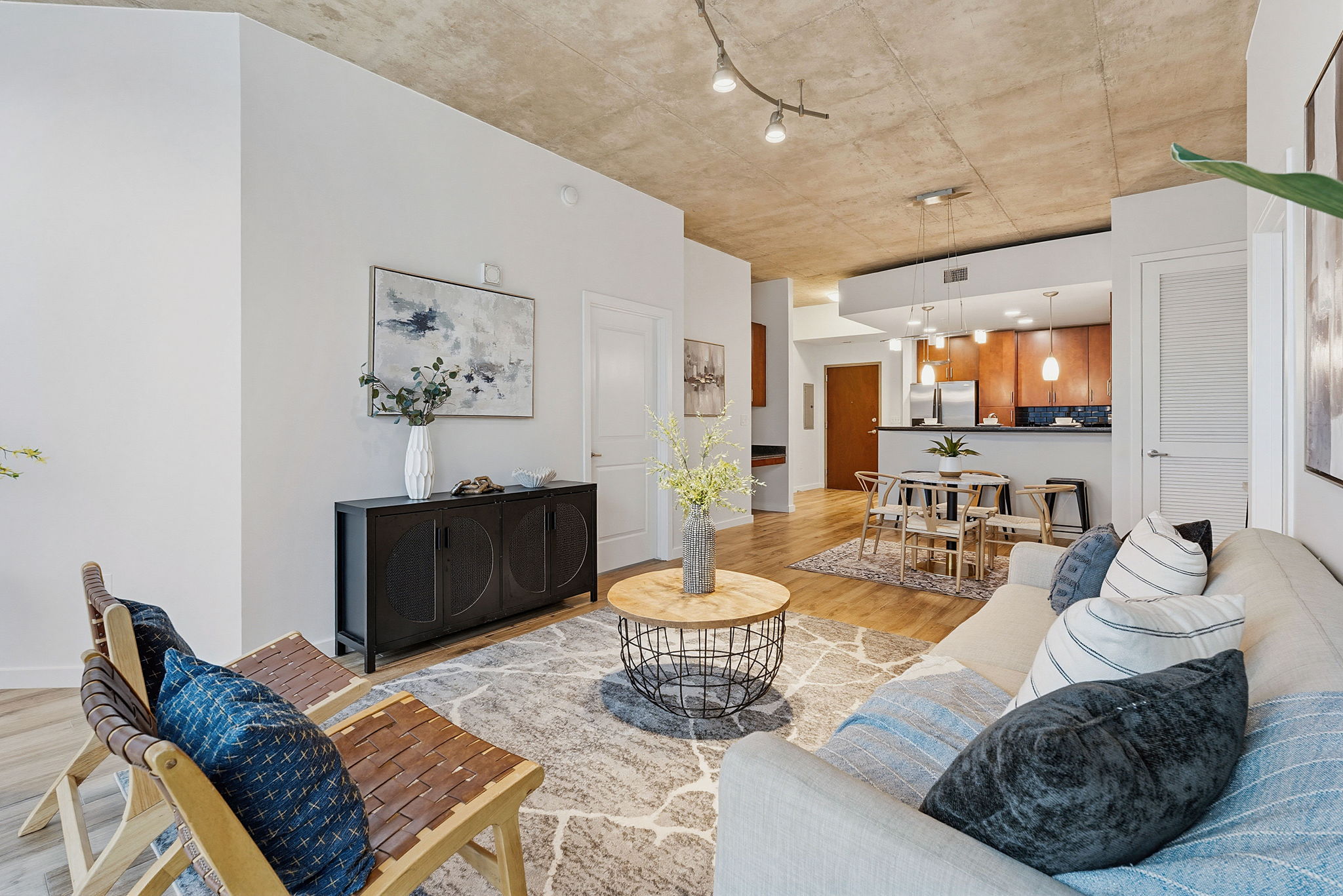 360 Nueces Street, Unit 1505 Austin, TX 78701 - Photo 3 of 28 a living room with furniture and a wooden floor