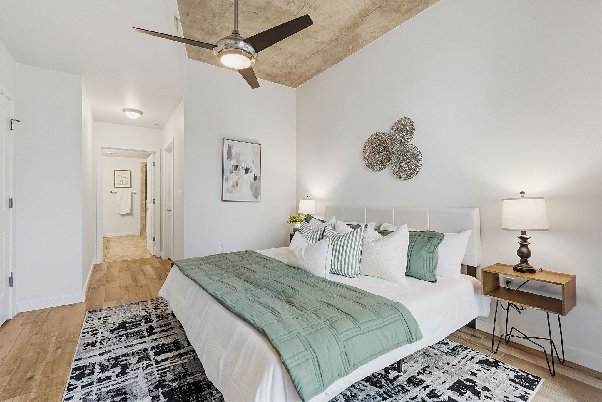360 Nueces Street, Unit 1505 Austin, TX 78701 - Photo 9 of 28 a bedroom with a bed and a table
