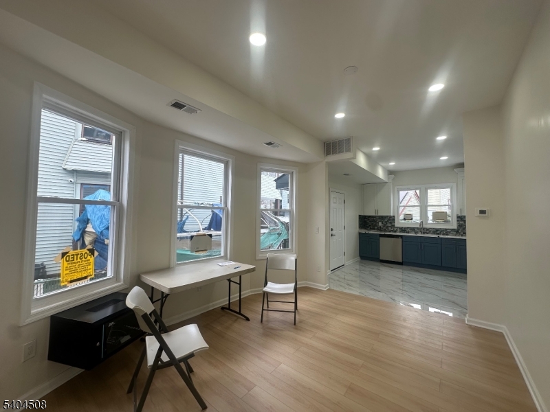 13 Vermont Avenue, Unit 2 Newark, NJ 07106 - Photo 2 of 20 a living room with stainless steel appliances furniture and a kitchen view