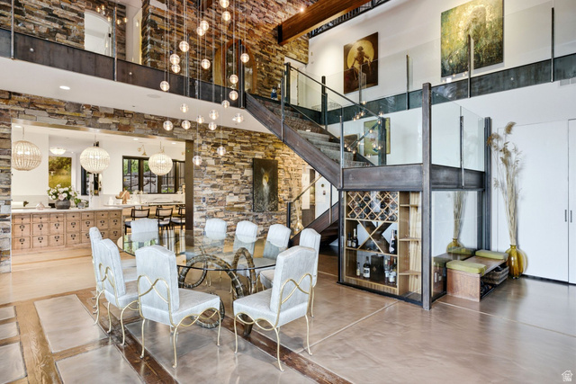 5971 Maple Ridge Trail Oakley, UT 84055 - Photo 13 of 43 Open-concept living space with multi-level design featuring a stone accent wall