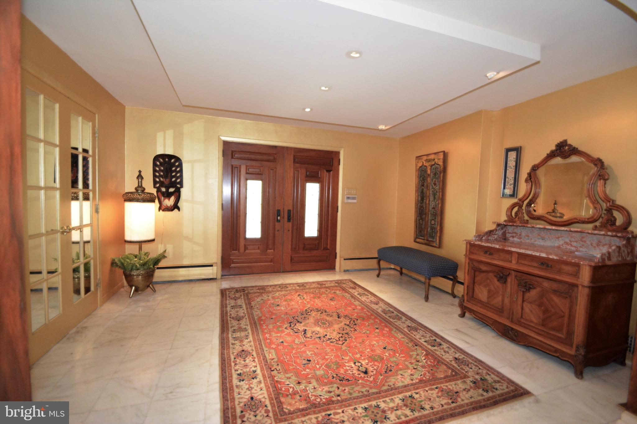 907 Summit Road Narberth, PA 19072 - Photo 3 of 30 entrance foyer with mirrored coat closet