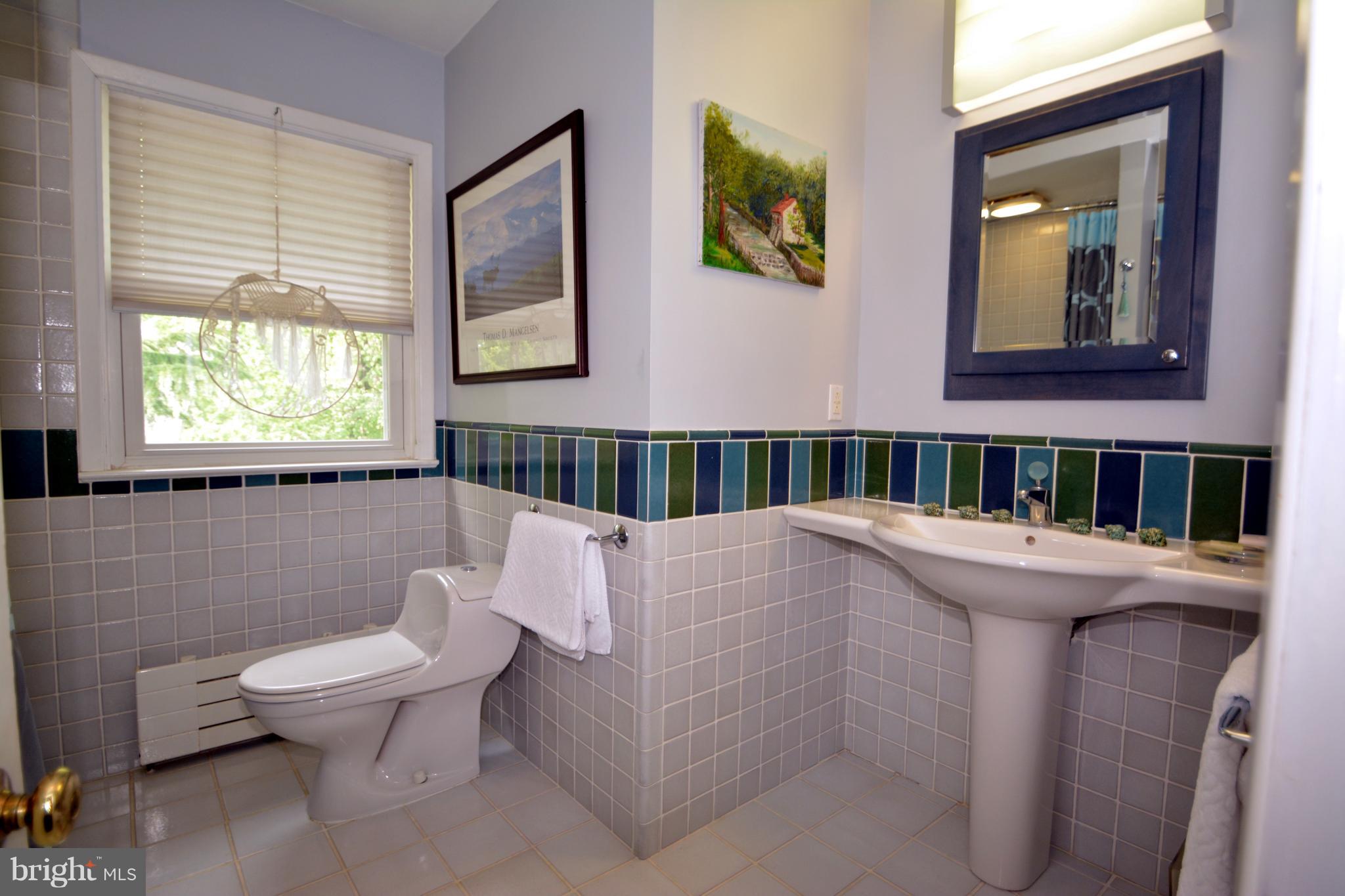 907 Summit Road Narberth, PA 19072 - Photo 22 of 30 ceramic tiled hall bath with oedestal sink