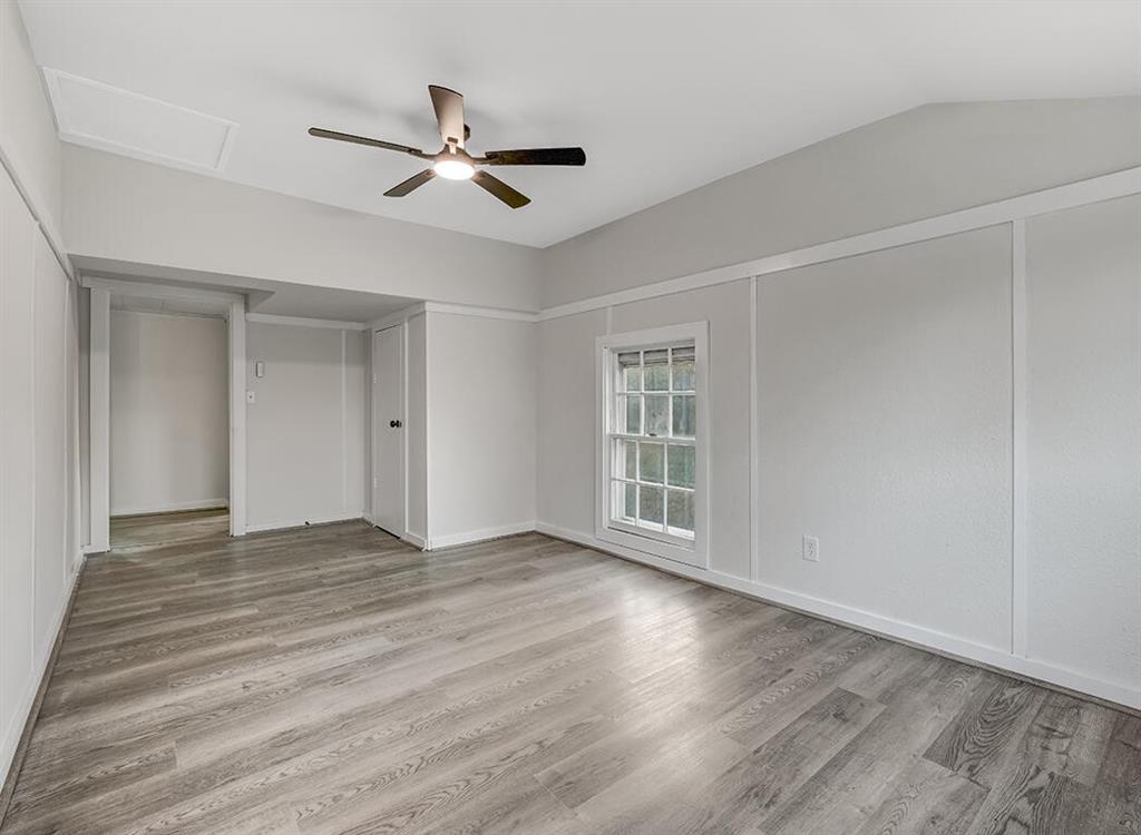 828 Unity Drive Wake Village, TX 75501 - Photo 14 of 14 a view of an empty room with wooden floor and a window