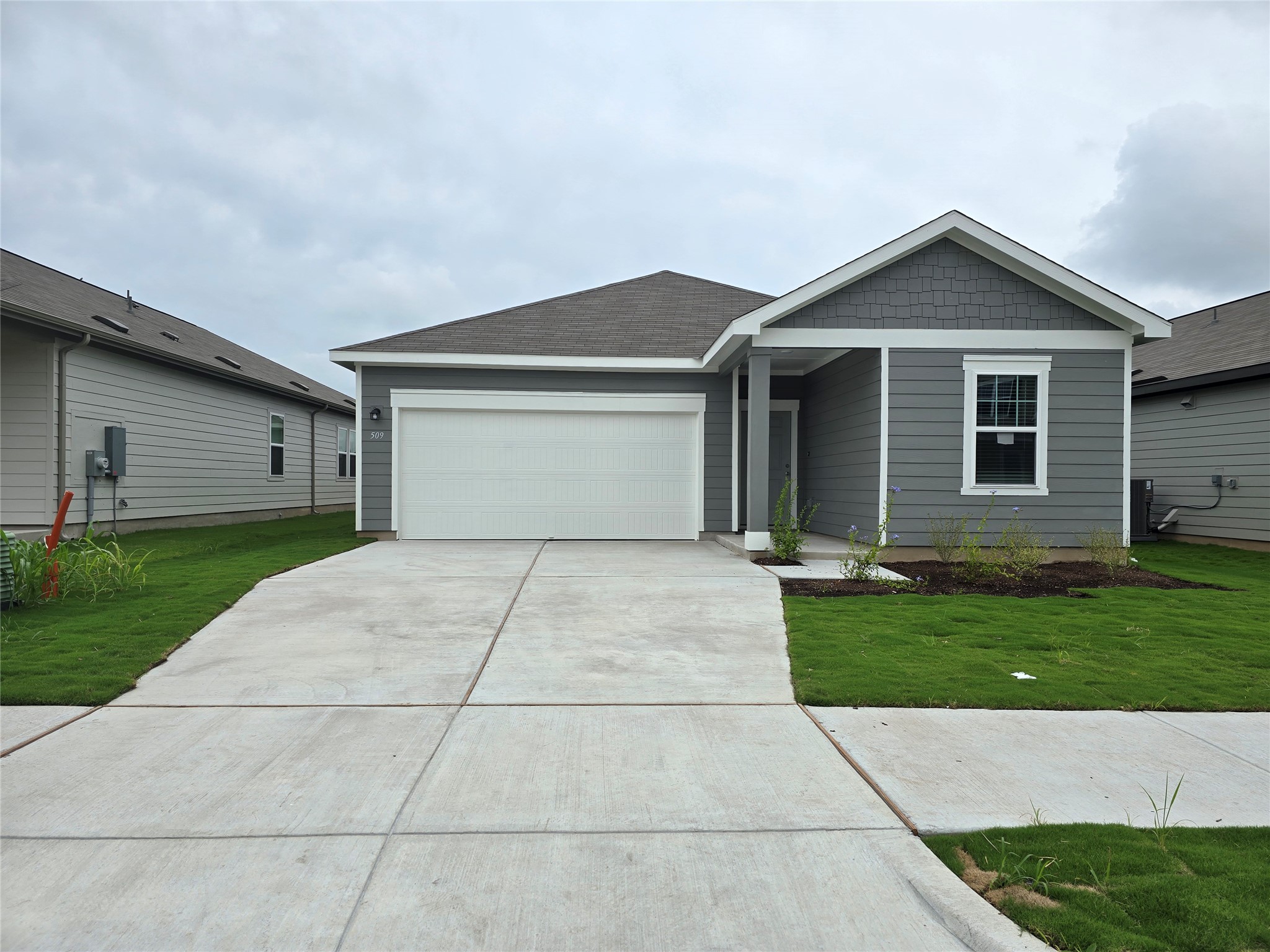 509 McFadin Way Taylor, TX 76574 - Photo 1 of 23 a front view of house with yard and green space