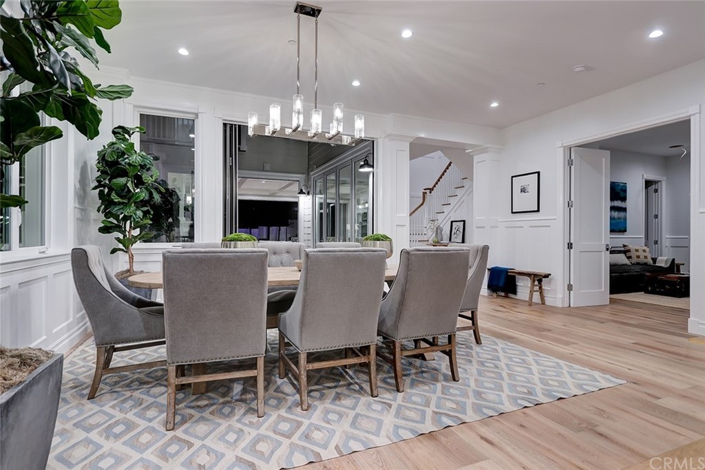 1751 8th Street Manhattan Beach, CA 90266 - Photo 16 of 43 a view of a dining room with furniture a livingroom and chandelier