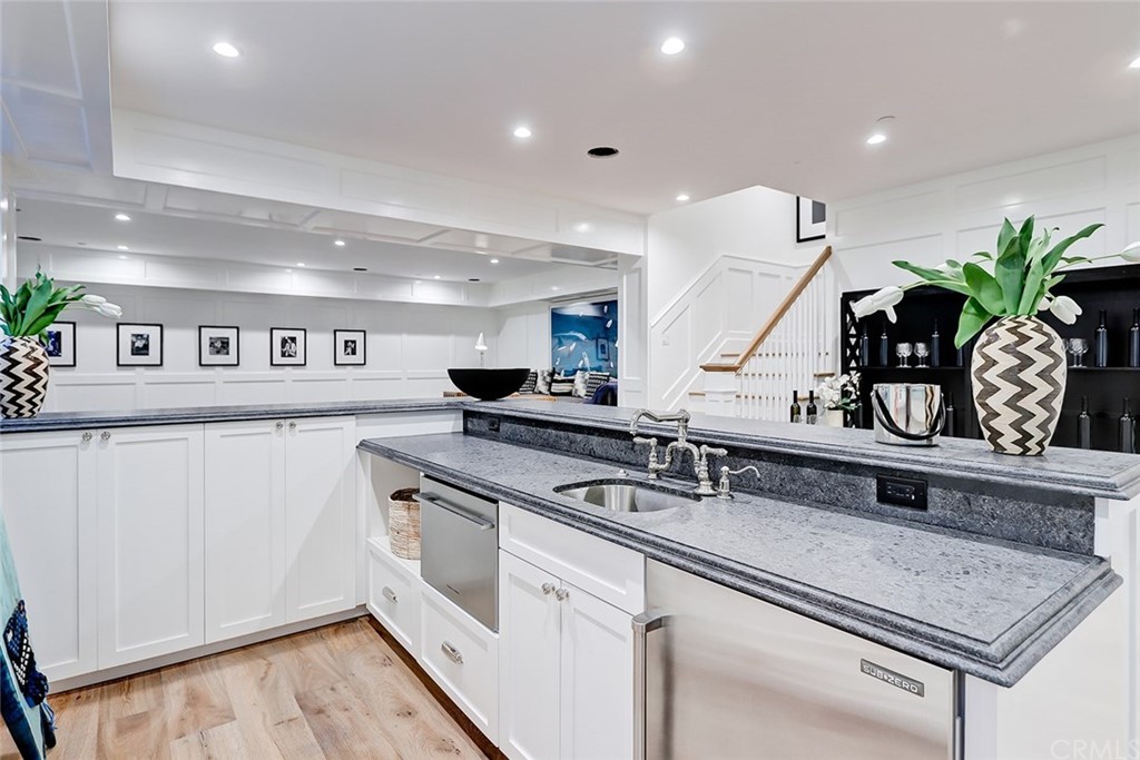 1751 8th Street Manhattan Beach, CA 90266 - Photo 22 of 43 a kitchen with stainless steel appliances granite countertop a sink a stove and a refrigerator
