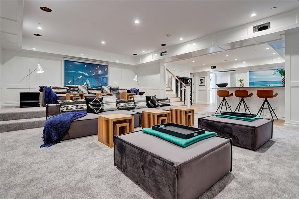 1751 8th Street Manhattan Beach, CA 90266 - Photo 23 of 43 a living room with stainless steel appliances furniture a rug and a kitchen view