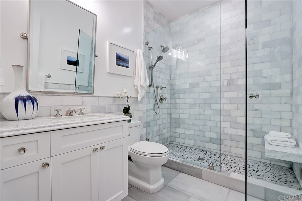 1751 8th Street Manhattan Beach, CA 90266 - Photo 28 of 43 a bathroom with a sink a toilet and shower