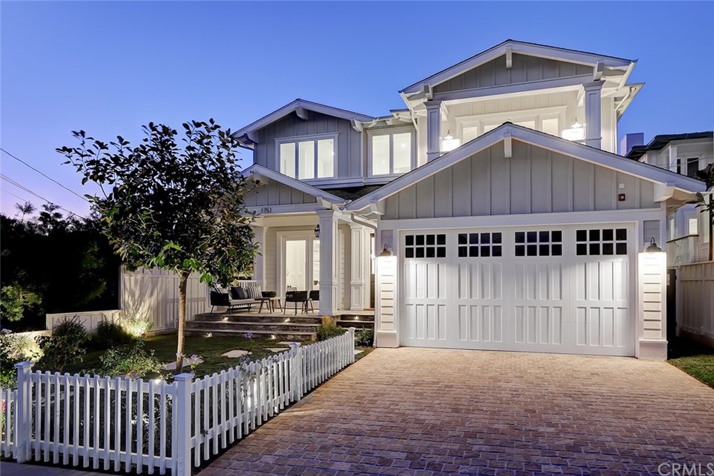 1751 8th Street Manhattan Beach, CA 90266 - Photo 3 of 43 a front view of a house with a garden