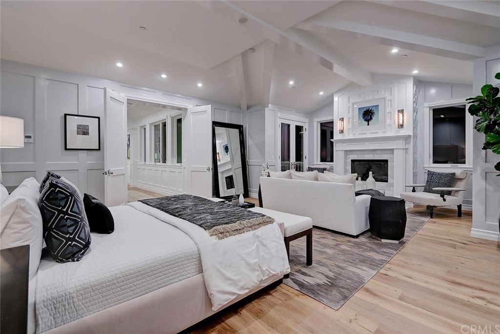 1751 8th Street Manhattan Beach, CA 90266 - Photo 33 of 43 a bedroom with a bed and a fireplace