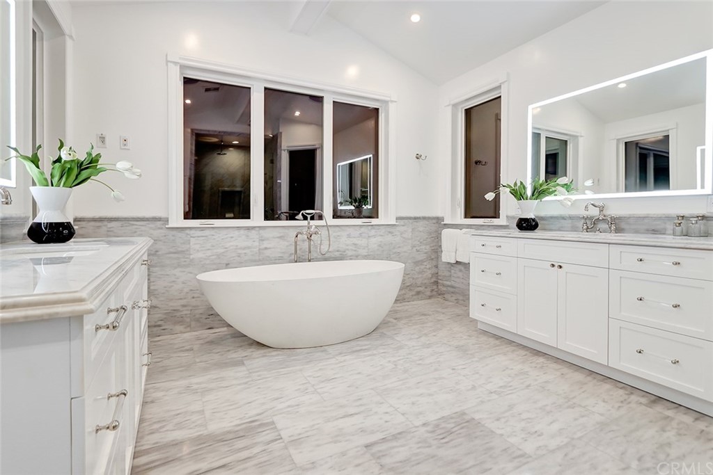 1751 8th Street Manhattan Beach, CA 90266 - Photo 34 of 43 a spacious bathroom with a double vanity sink and a mirror