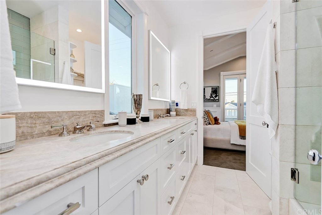 1751 8th Street Manhattan Beach, CA 90266 - Photo 39 of 43 a spacious bathroom with a double vanity sink mirror and